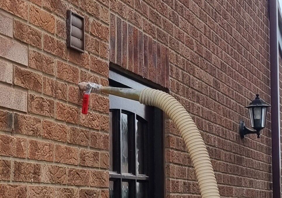 cavity wall insulation hose in wall